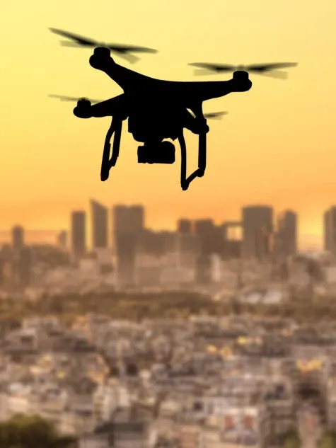 RPAS Drone Silhouette Flying Above City